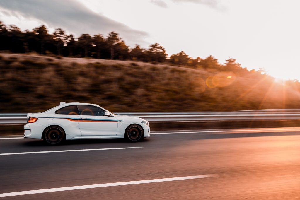 Novo Radar: O Poderoso Trucam white coupe sedan driving road sunset