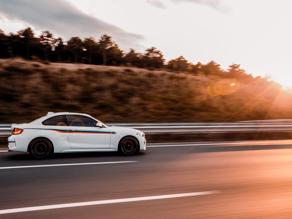 Novo Radar: O Poderoso Trucam white coupe sedan driving road sunset